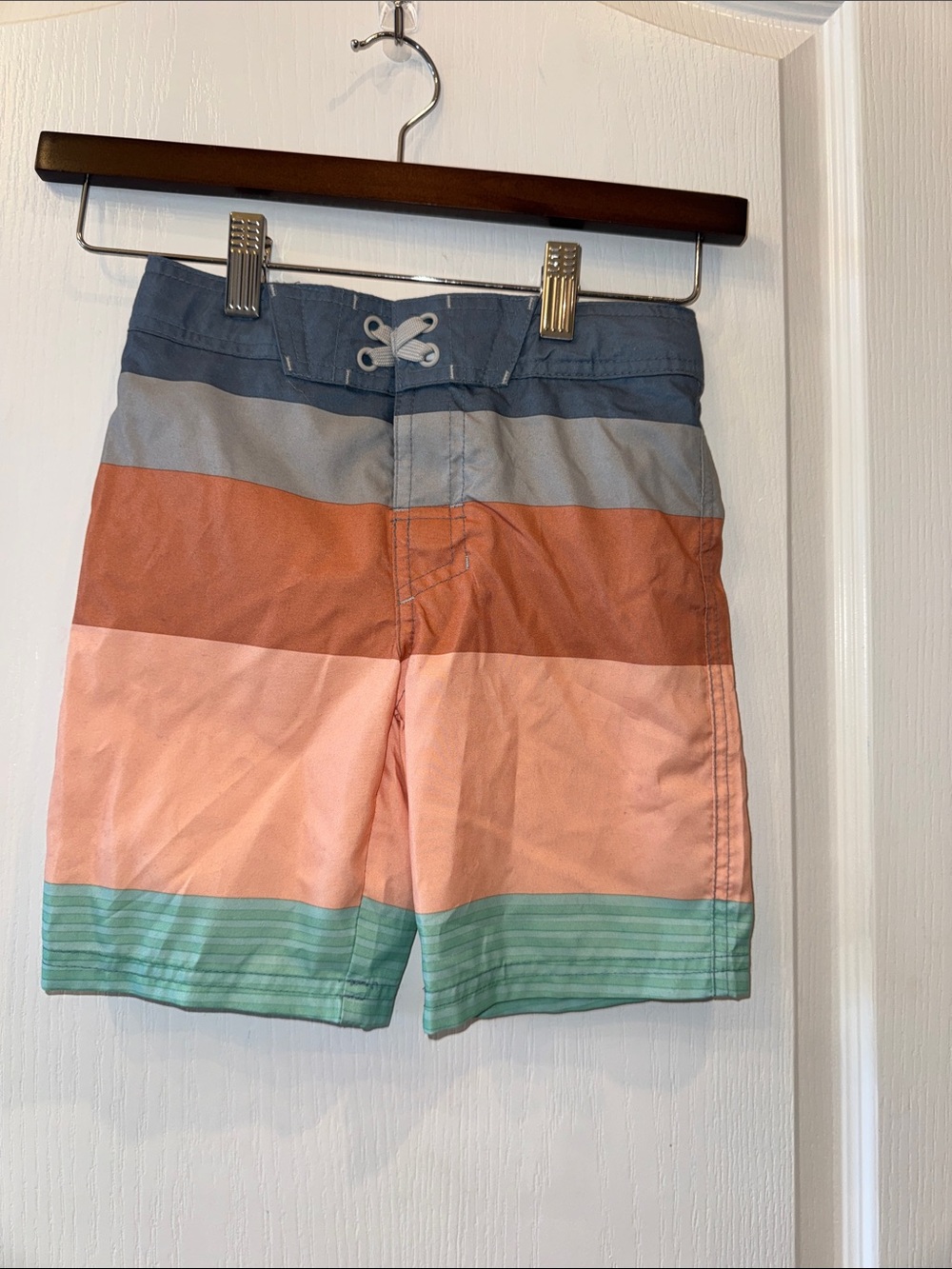 art class Boys' Striped Swim Trunks in Blue, Gray, Rust, Peach, and Mint